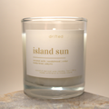 Candle labeled 'island sun' with a beige background