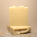 Two bars of soap stacked on a neutral background